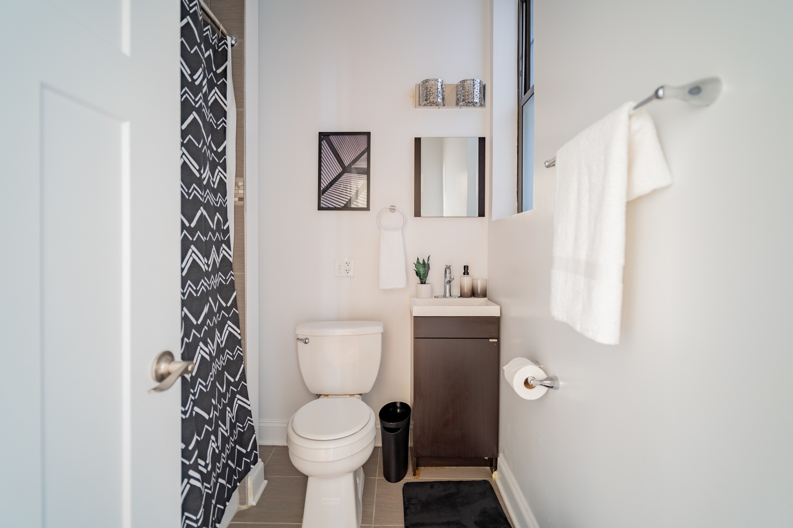 2989 North Lawndale Avenue, Unit 1 Chicago, IL 60618 - Photo 12 of 18 a bathroom with a toilet sink and shower curtain