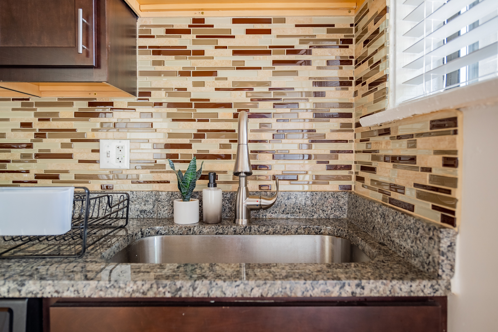 2989 North Lawndale Avenue, Unit 1 Chicago, IL 60618 - Photo 18 of 18 a bathroom with a granite countertop sink and a mirror
