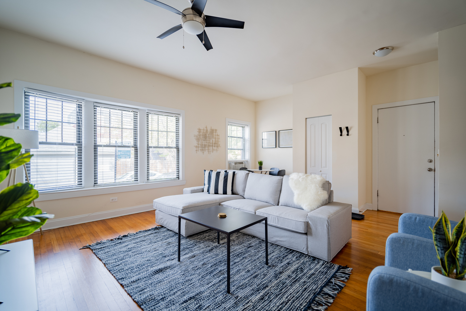 2989 North Lawndale Avenue, Unit 1 Chicago, IL 60618 - Photo 6 of 18 a living room with furniture and a potted plant