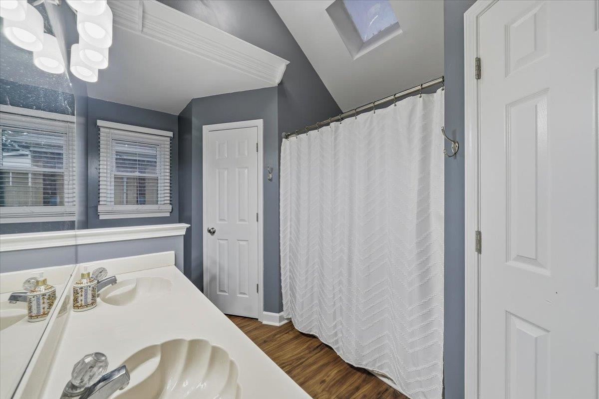 406 Ashley Drive Collierville, TN 38017 - Photo 12 of 20 a bathroom with a sink and a mirror