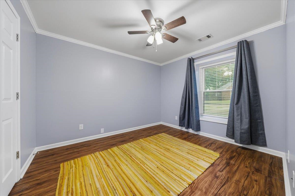 406 Ashley Drive Collierville, TN 38017 - Photo 13 of 20 a view of a room with wooden floor and a ceiling fan