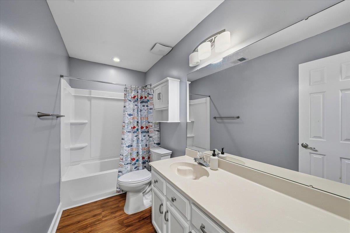 406 Ashley Drive Collierville, TN 38017 - Photo 14 of 20 a bathroom with a sink a toilet and shower