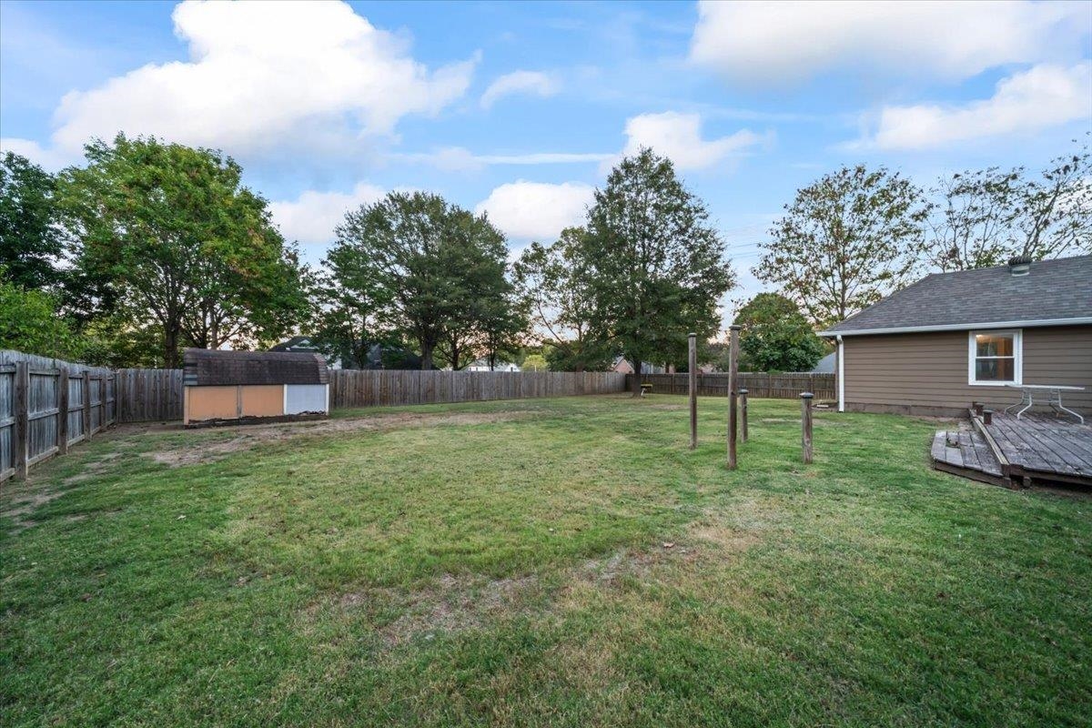 406 Ashley Drive Collierville, TN 38017 - Photo 18 of 20 a backyard of a house with lots of green space