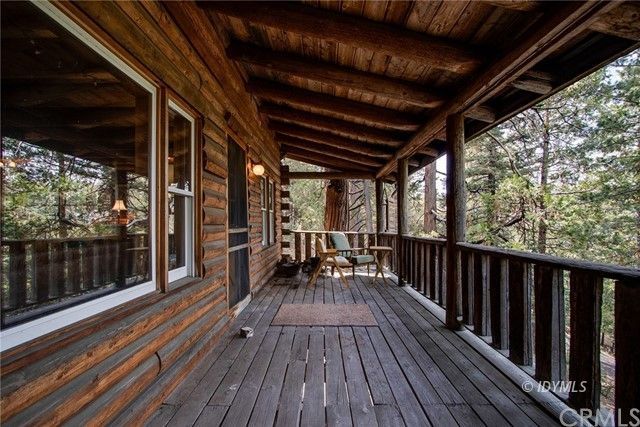 25121 Pine Cove Road Idyllwild, CA 92549 - Photo 2 of 10 a view of balcony with wooden floor and outdoor space