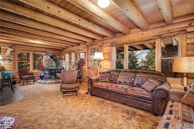 25121 Pine Cove Road Idyllwild, CA 92549 - Photo 5 of 10 a living room with furniture and a large window