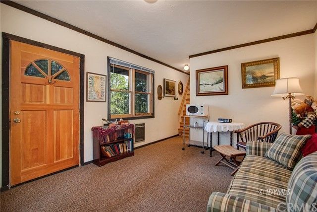 25121 Pine Cove Road Idyllwild, CA 92549 - Photo 9 of 10 a living room with furniture and a window
