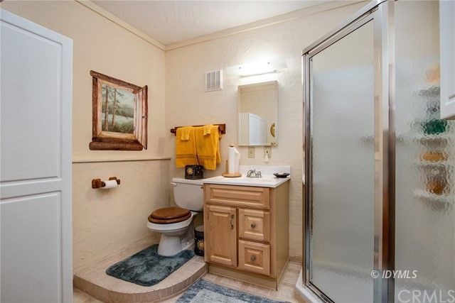 25121 Pine Cove Road Idyllwild, CA 92549 - Photo 10 of 10 a bathroom with a sink toilet and a shower