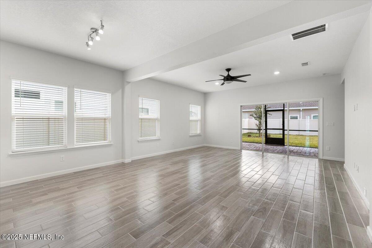 24 Purus Way St. Johns, FL 32259 - Photo 12 of 37 a view of an empty room with a window and wooden floor