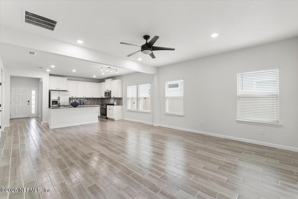 24 Purus Way St. Johns, FL 32259 - Photo 14 of 37 a view of kitchen with cabinets and wooden floor