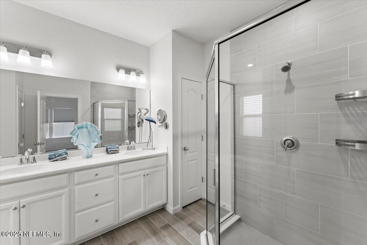 24 Purus Way St. Johns, FL 32259 - Photo 19 of 37 a spacious bathroom with double sink shower and two mirror