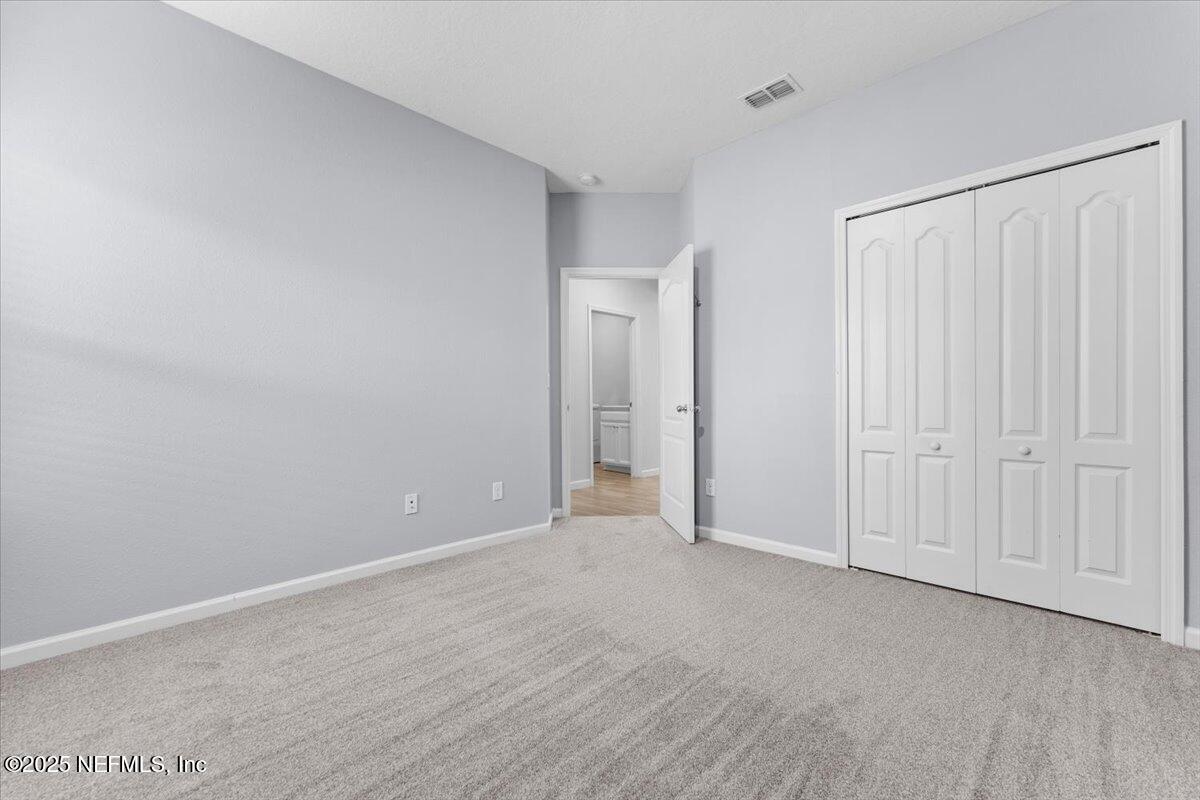 24 Purus Way St. Johns, FL 32259 - Photo 23 of 37 a view of an empty room and wooden floor