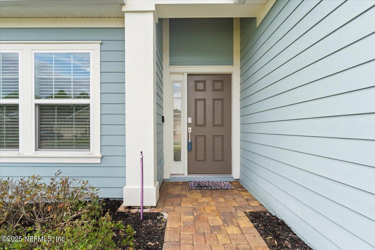 24 Purus Way St. Johns, FL 32259 - Photo 3 of 37 a view of house with entryway door and wooden floor