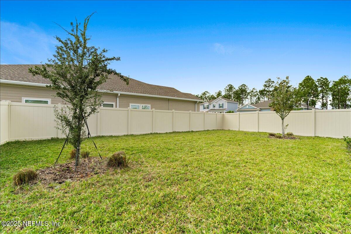 24 Purus Way St. Johns, FL 32259 - Photo 32 of 37 a view of a backyard with a garden