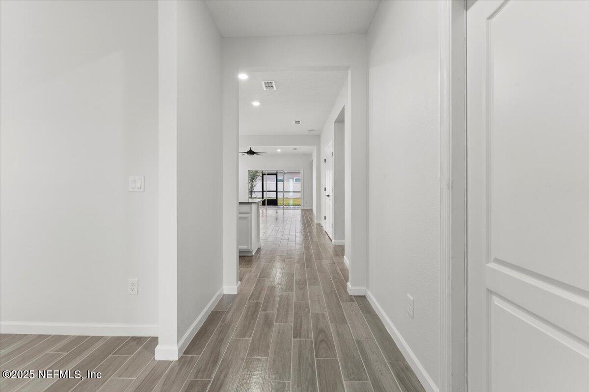 24 Purus Way St. Johns, FL 32259 - Photo 4 of 37 a view of a hallway with wooden floor