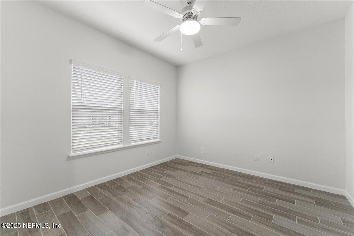 24 Purus Way St. Johns, FL 32259 - Photo 5 of 37 an empty room with wooden floor and windows