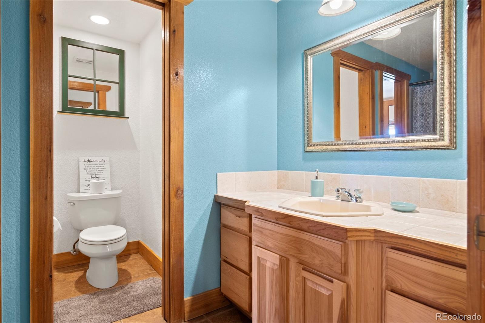 412 Evergreen Road Black Hawk, CO 80422 - Photo 9 of 48 a bathroom with a sink and a mirror