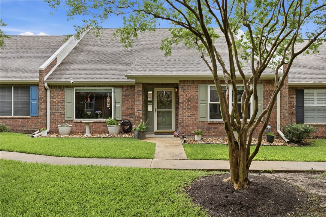 1520 Bennett Street Bryan, TX 77802 - Photo 1 of 24 a front view of a house with garden