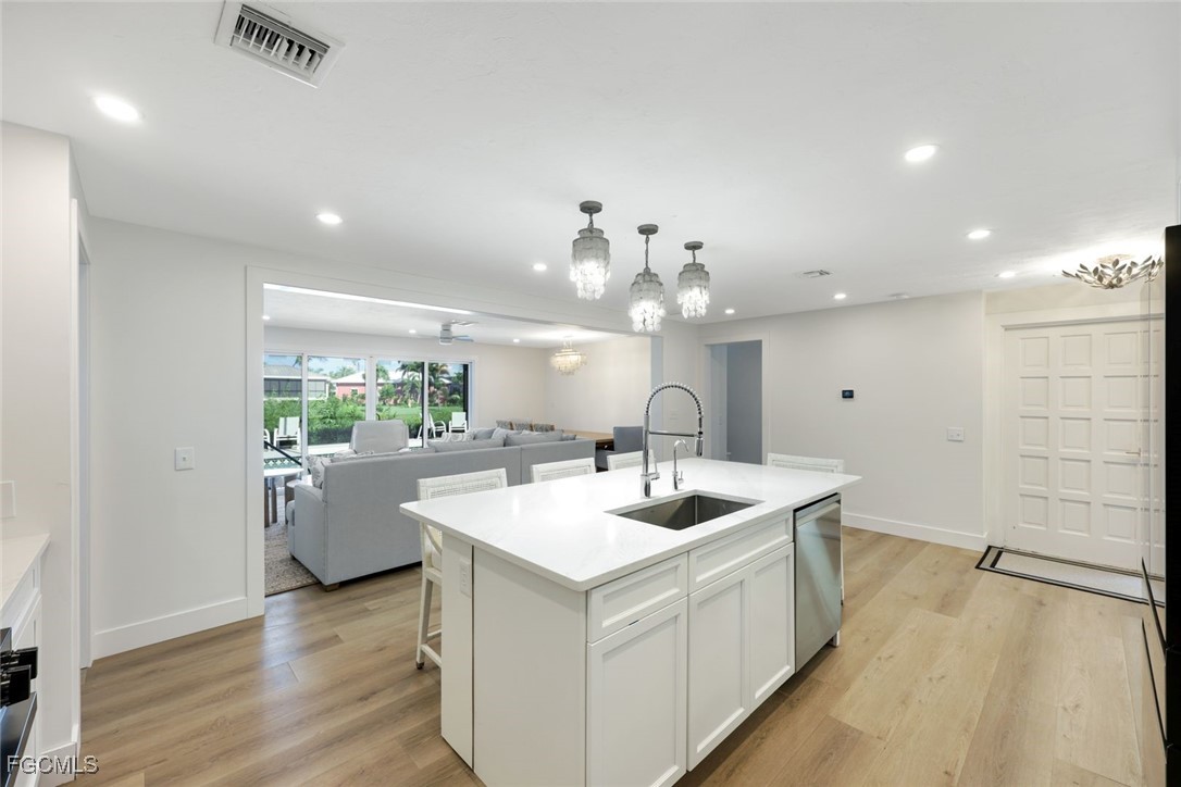 707 Durion Court Sanibel, FL 33957 - Photo 11 of 31 a kitchen with a sink and refrigerator