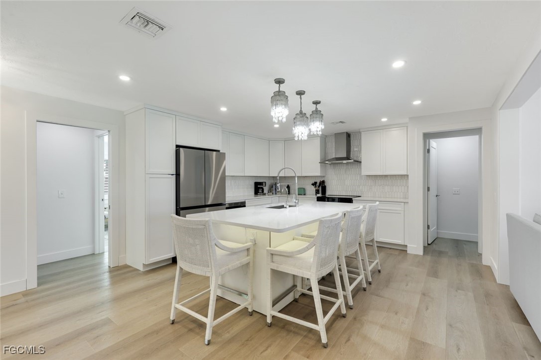 707 Durion Court Sanibel, FL 33957 - Photo 12 of 31 a kitchen with kitchen island and stainless steel appliances