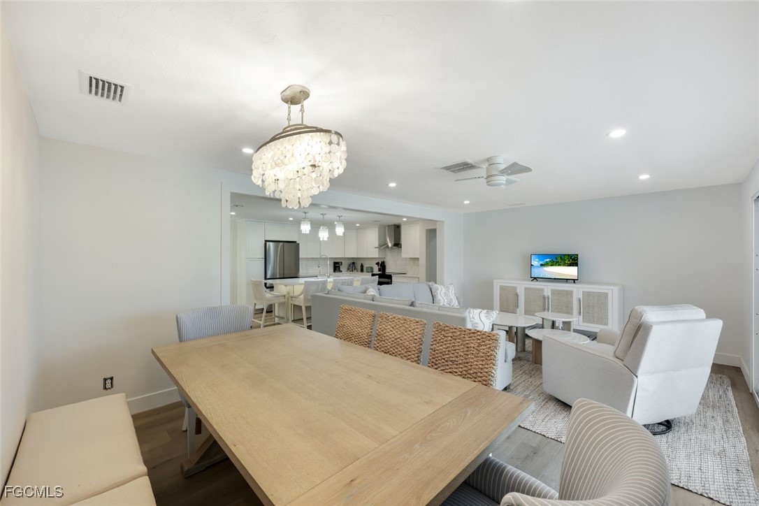 707 Durion Court Sanibel, FL 33957 - Photo 14 of 31 a large white kitchen with a white table and chairs