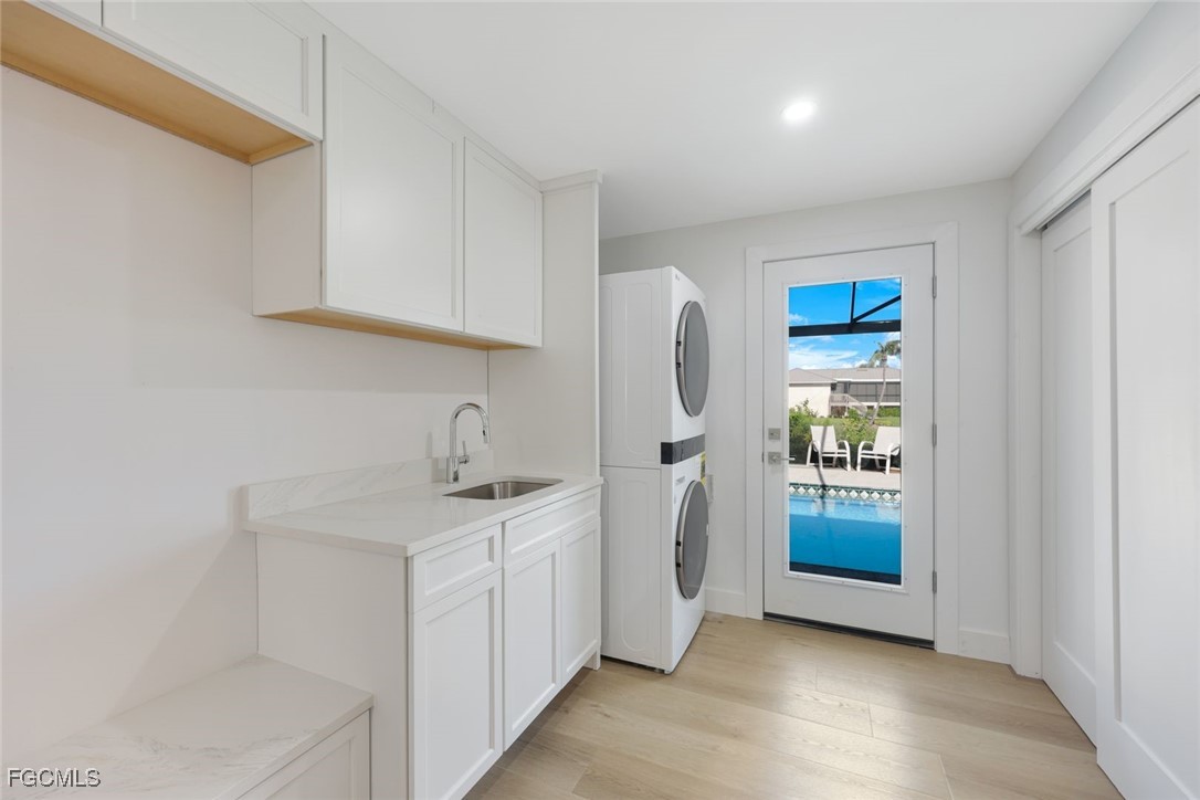 707 Durion Court Sanibel, FL 33957 - Photo 20 of 31 a kitchen with stainless steel appliances granite countertop a refrigerator and a sink