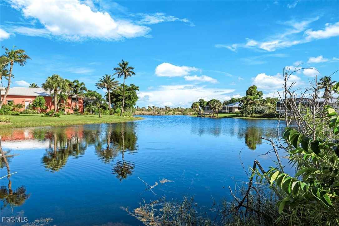 707 Durion Court Sanibel, FL 33957 - Photo 26 of 31 a view of a lake with houses in the back