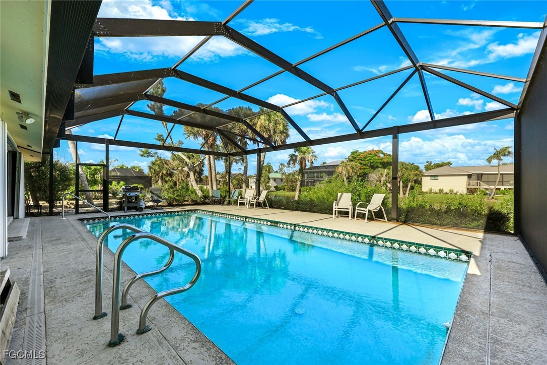 707 Durion Court Sanibel, FL 33957 - Photo 4 of 31 a view of swimming pool with a patio