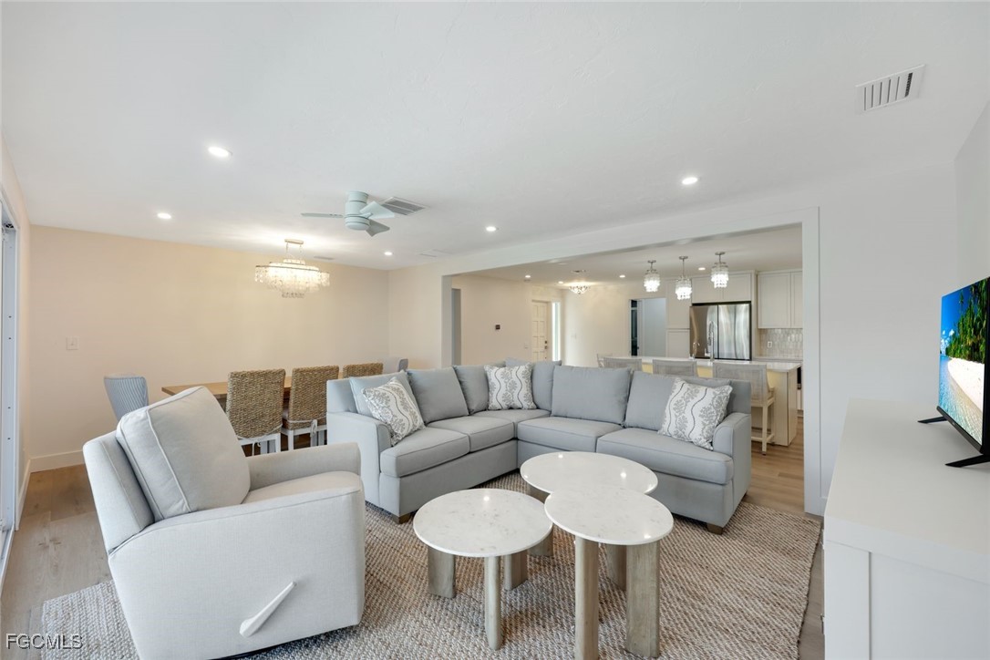 707 Durion Court Sanibel, FL 33957 - Photo 6 of 31 a living room with furniture and a large mirror