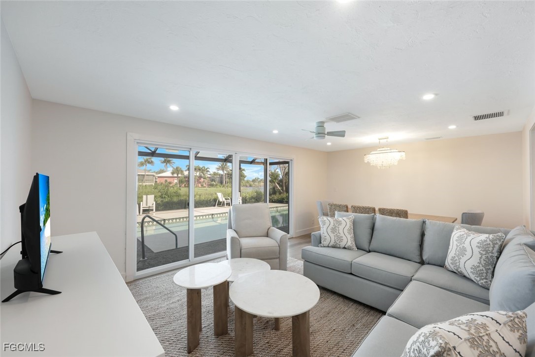 707 Durion Court Sanibel, FL 33957 - Photo 8 of 31 a living room with furniture and a large window