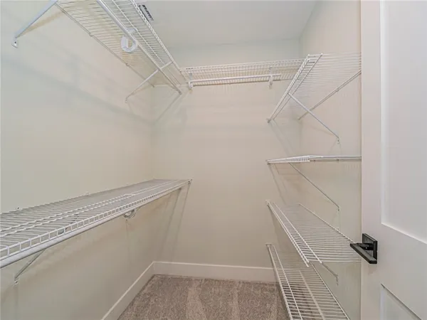 a view of a room with racks on the wall