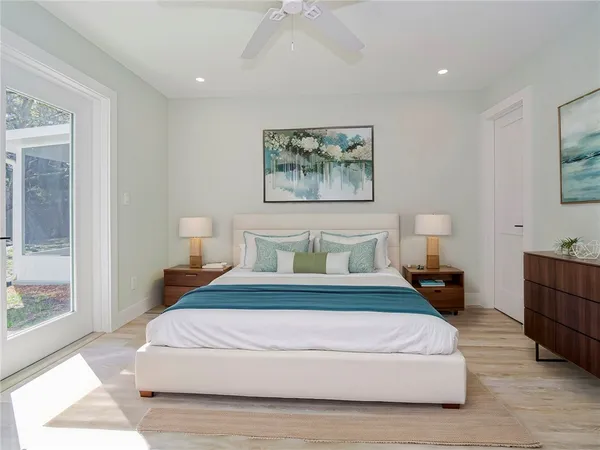 a bedroom with bed and window