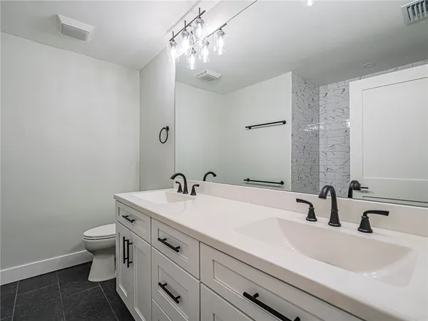 a bathroom with a sink and a toilet