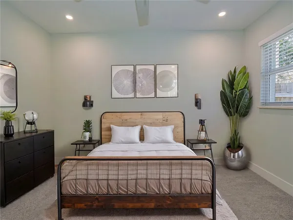 a bedroom with a bed and window