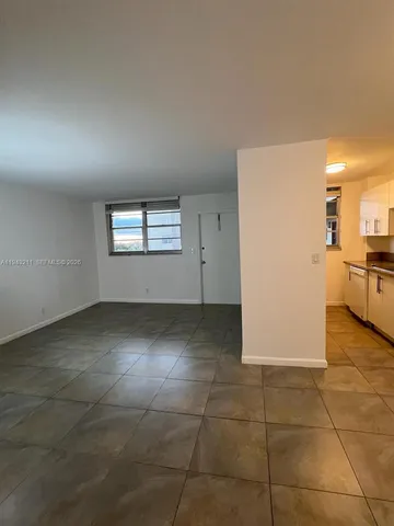 a view of a kitchen with a sink and a stove top oven