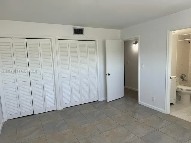 an empty room with a bathroom