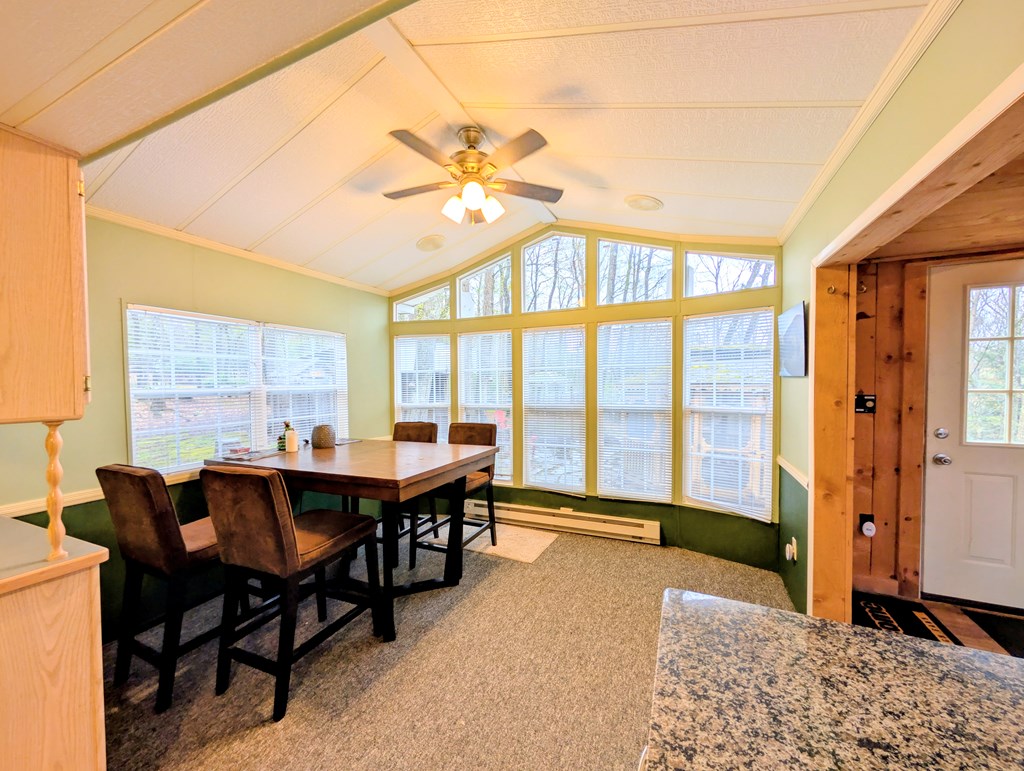 207 Seneca Hills Road Tionesta, PA 16353 - Photo 11 of 16 a view of a dining room with furniture window and outside view