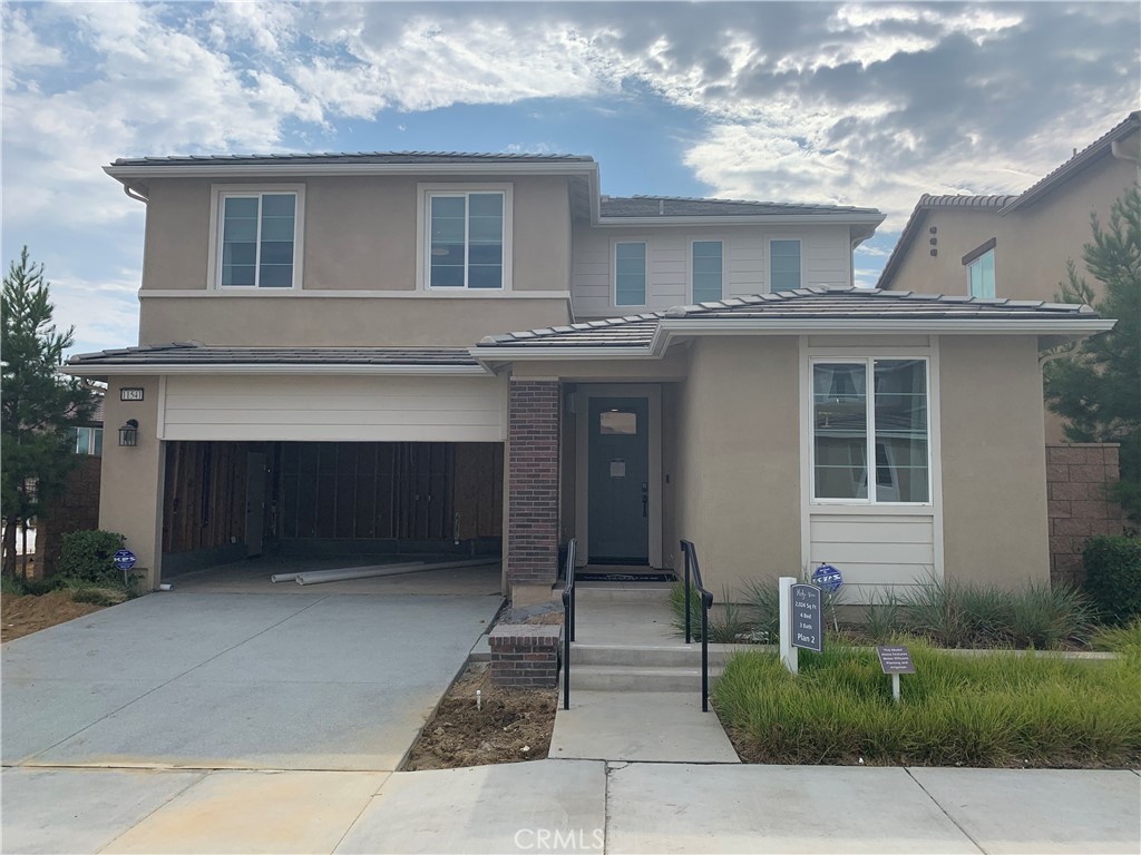 a front view of a house with yard