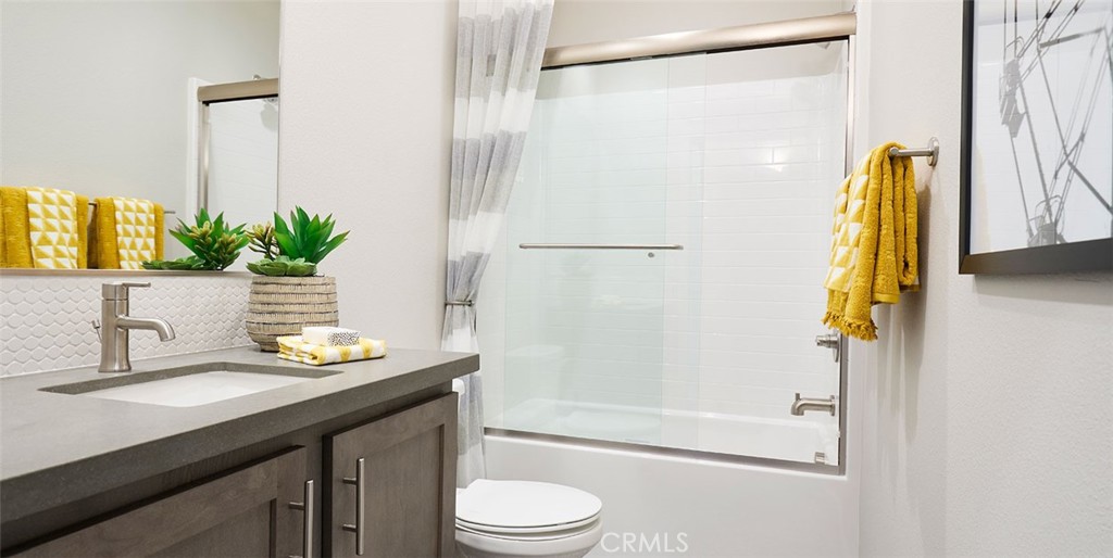 11541 Jack Street Beaumont, CA 92223 - Photo 2 of 11 a bathroom with a sink a toilet and shower