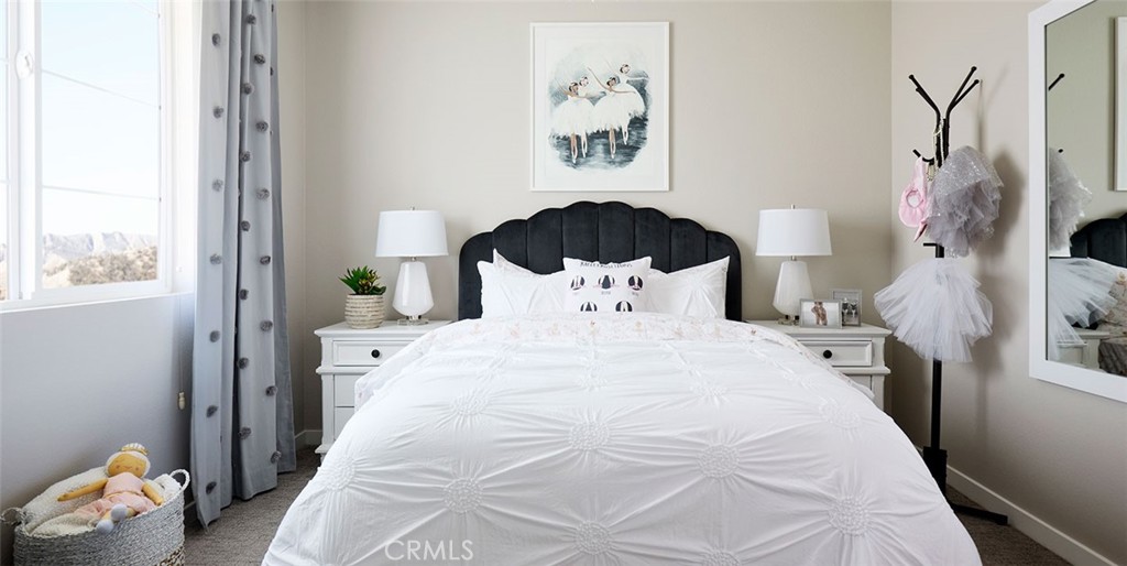 11541 Jack Street Beaumont, CA 92223 - Photo 3 of 11 a bedroom with a bed and a window