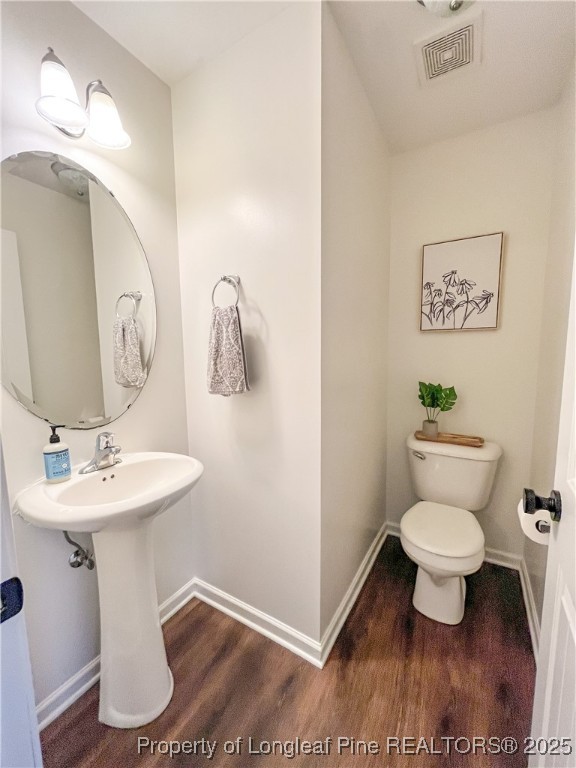 52 Expedition Drive Cameron, NC 28326 - Photo 7 of 14 a bathroom with a toilet sink and mirror
