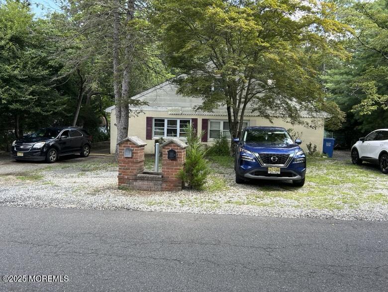 401-403 Glenn Road Jackson, NJ 08527 - Photo 7 of 8 a car parked in front of white house