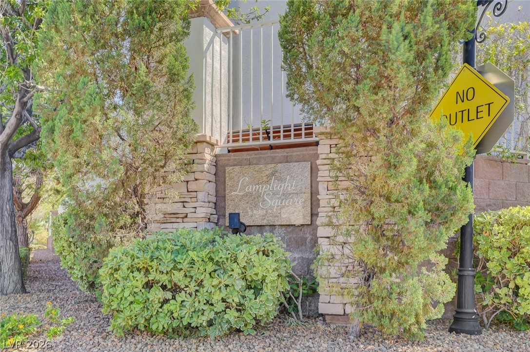 977 Sparkling Light Street Henderson, NV 89052 - Photo 69 of 75 Welcome to Lamplight Square, a charming community entrance framed by lush greenery.