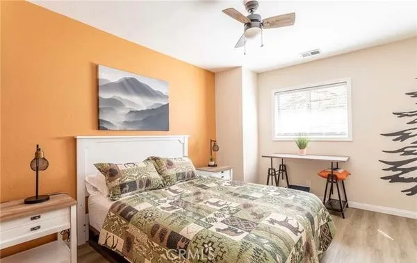 a bedroom with a bed and a table