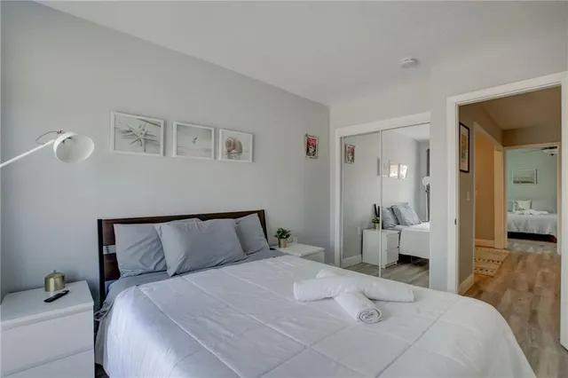 a bedroom with a bed and a mirror