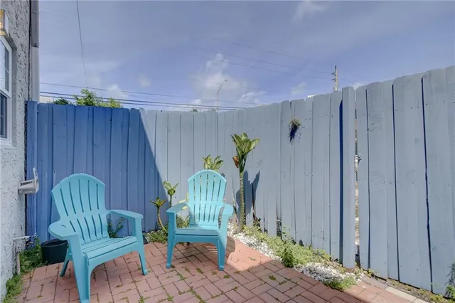 a view of a deck with chair and potted plant