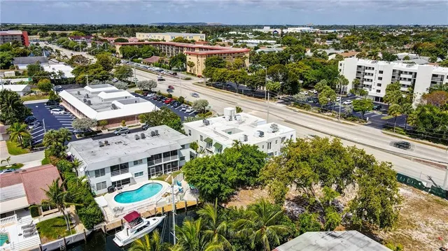an aerial view of residential houses with outdoor space