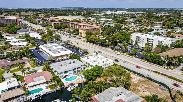 an aerial view of residential houses with outdoor space