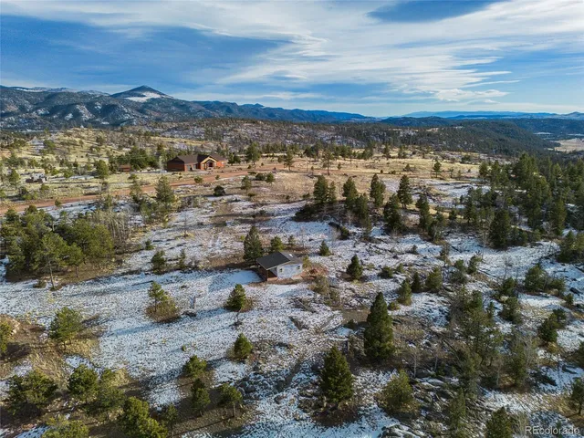 a view of a city with mountains in the background