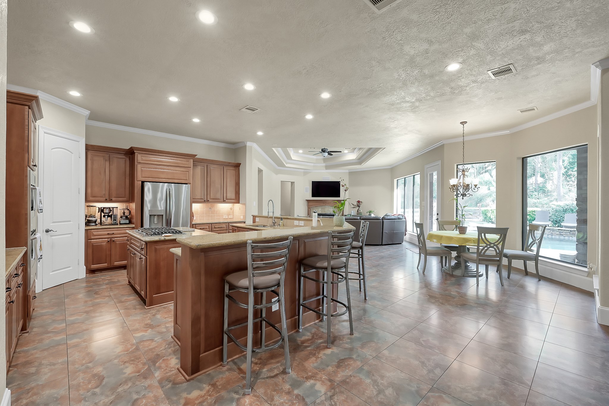 22742 Timberlake Creek Road Tomball, TX 77377 - Photo 16 of 50 a kitchen with lots of counter top space and dining table