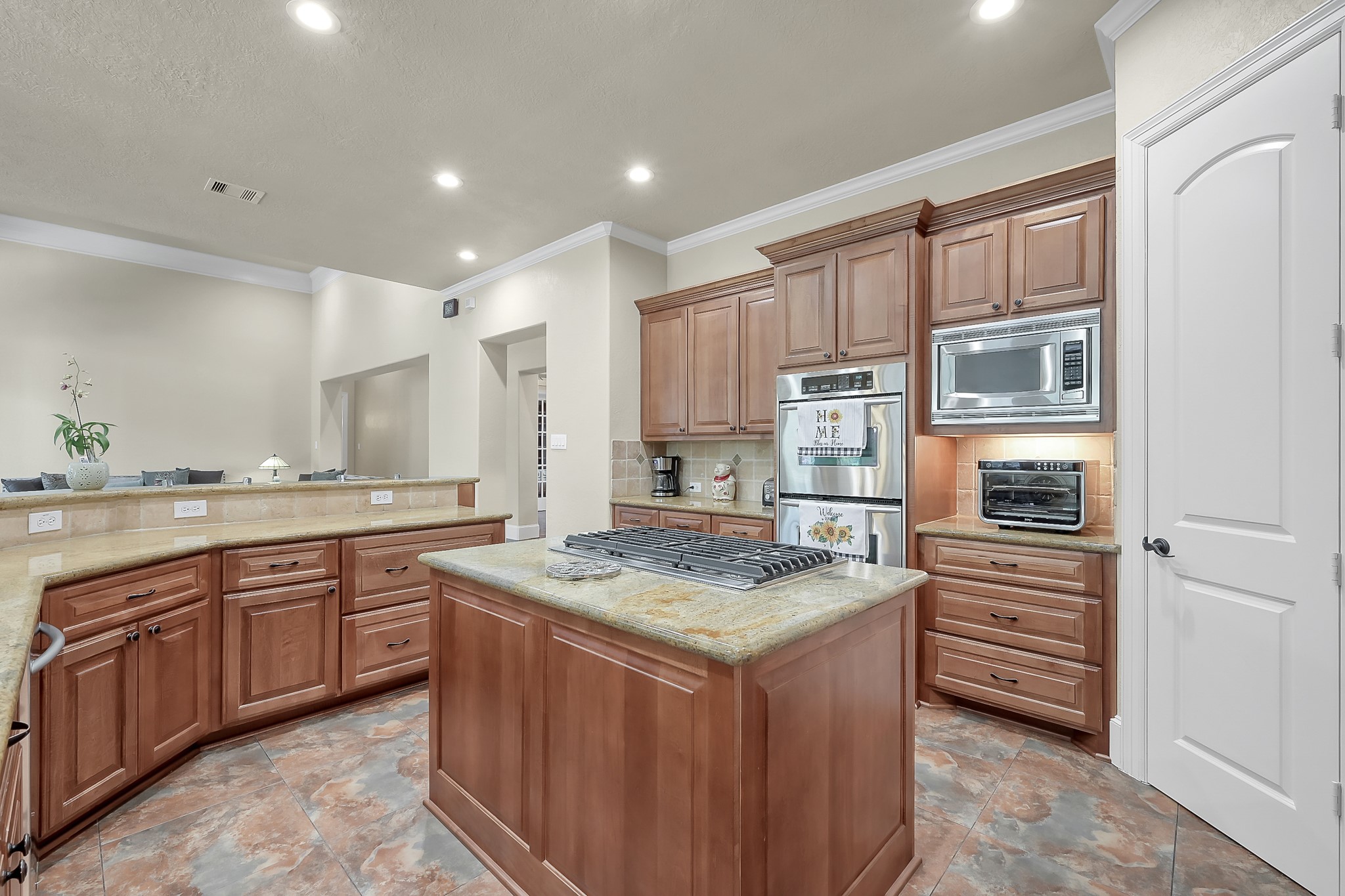 22742 Timberlake Creek Road Tomball, TX 77377 - Photo 19 of 50 a kitchen with stainless steel appliances granite countertop a sink stove and refrigerator